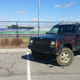 The Jeep Cherokee poses in front of Kansas Speedway in Kansas City.